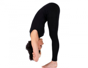 A woman demonstrating the forward fold yoga pose that can help relieve menstrual cramps