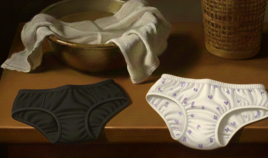Illustrated still life showing two pairs of underwear laid side by side on a wooden surface—one dark and one light with small patterns—suggesting a comparison between disposable and reusable period products. A cloth draped over a bowl and a woven basket appear in the background.