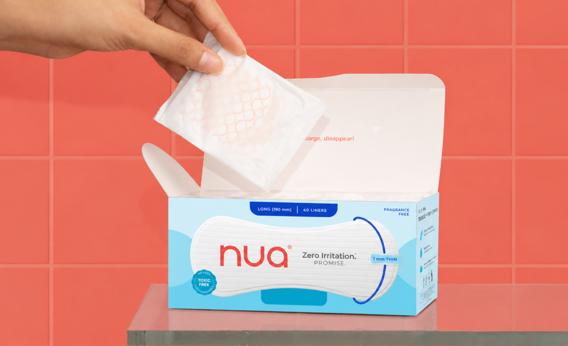 Nua panty liner box with a hand taking out an individually wrapped liner, against a coral tiled background.
